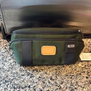 Tumi Green and Black Travel Pouch